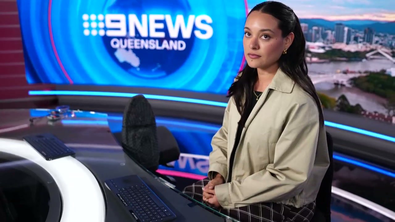 Chelsea seated at the Nine News Queensland desk during a studio reel
